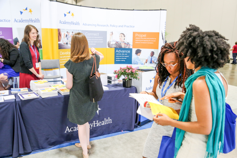 ARM 2019 attendees at the AcademyHealth booth