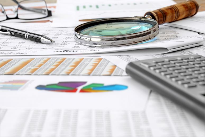 Accounting Tools, financial data and charts on the Table 