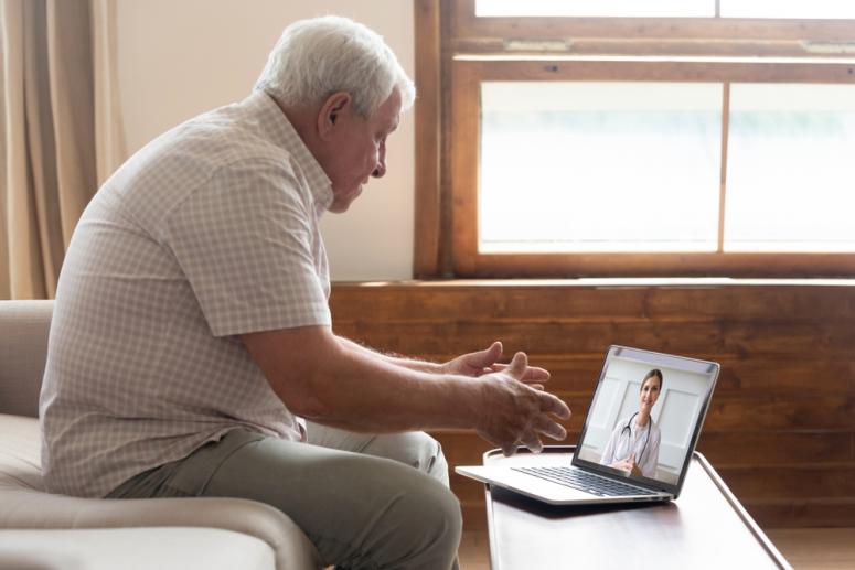 older man talking to a doctor on telehealth